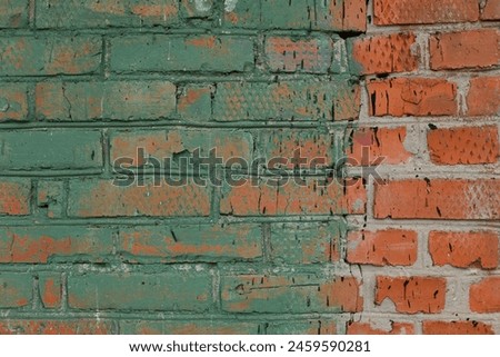 An old, colored, destroyed brick wall in full screen.