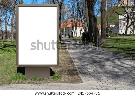 Blank Wooden Billboard Mockup In City Park. Outdoor Advertising Poster Lightbox On The Sidewalk