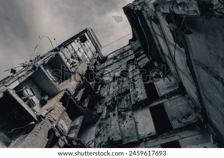 destroyed and burned houses in the city Russia Ukraine war Royalty-Free Stock Photo #2459617693