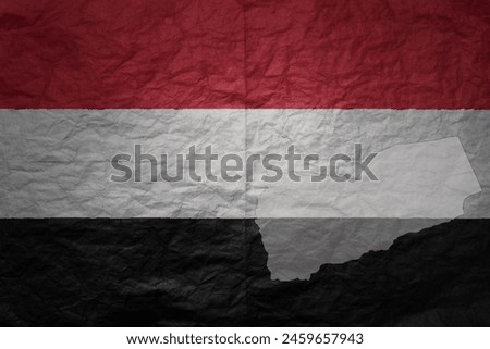 colorful big national flag and map of yemen on a grunge old paper texture background