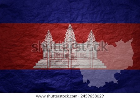 colorful big national flag and map of cambodia on a grunge old paper texture background