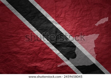colorful big national flag and map of trinidad and tobago on a grunge old paper texture background