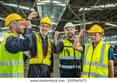 Group of colleague Engineer team join stack hand together with Spirit diversity solidarity power team in factory. foreman Join hand show oneness unity together teamwork friendship empower.