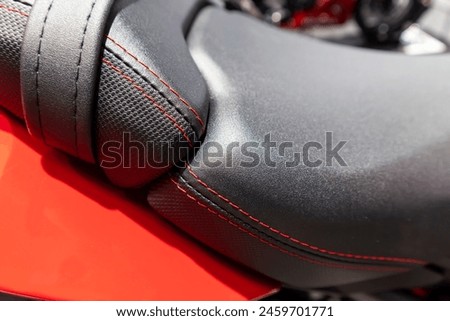 view of a leather motorcycle. macro picture. ,natural suede leather background with an abstract texture