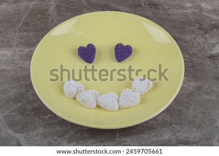 Smile picture made from cookies,on the plate, on the marble background. High quality photo