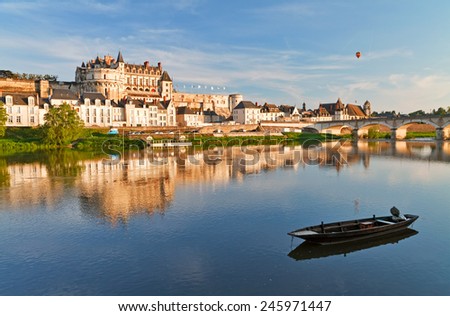 View on Amboise through Loire river at evening, France. Royalty-Free Stock Photo #245971447