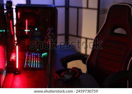 Playing video games. Modern computer and gaming chair indoors
