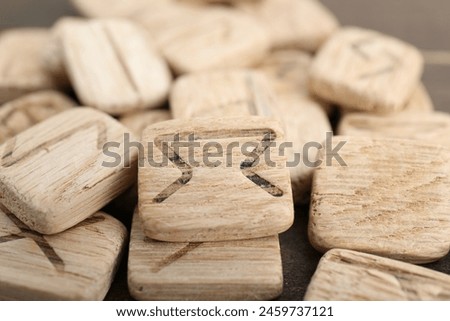 Pile of wooden runes as background, closeup view