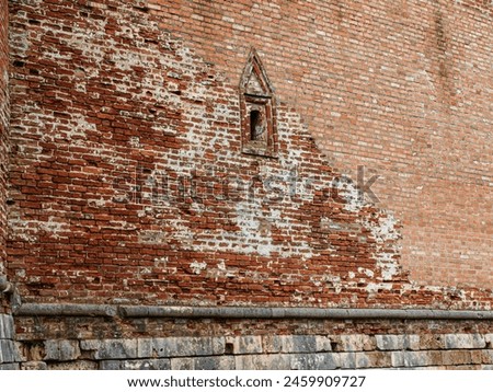Loophole with decorative casing in the fortress Royalty-Free Stock Photo #2459909727