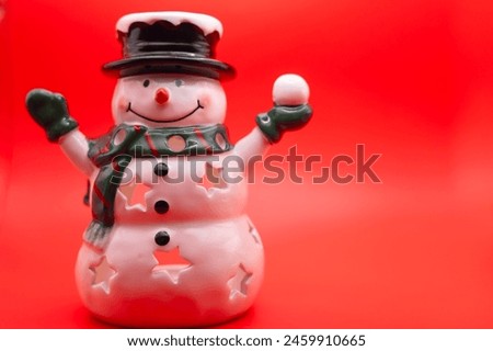 Snowman Figurine on Red Background Holiday Home Decoration 
