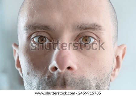 close up part male face, young man 25-30 years old, human eye looking directly, concept surveillance, vision examination, cosmetic procedures Royalty-Free Stock Photo #2459915785