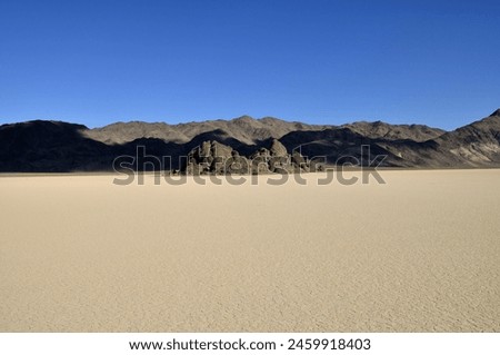 Landscape of mountains and rocks in an ancient dry playa in death valley national park. 