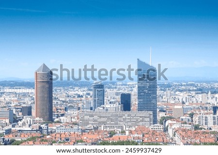 Aerial panoramic view of Lyon with the skyline of Lyon skyscrapers visible in background during a sunny blue sky afternoon. Lyon is the second biggest city of france and a major economic hub.