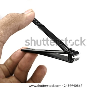 Black nail clippers isolated on white background