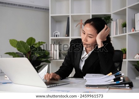 Asian women are stressed while working on laptop, Tired asian businesswoman with headache at office, feeling sick at work, copy space. Royalty-Free Stock Photo #2459961573
