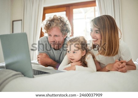 Parents. child and relax with laptop on bed, house and bonding, watching movie or streaming online for entertainment. Family, girl and together, internet and screen, subscription or cartoon film