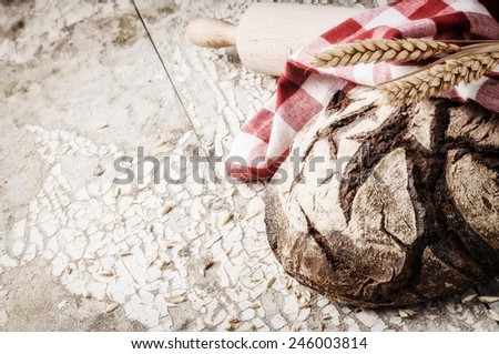Freshly baked bread loaf in rustic setting