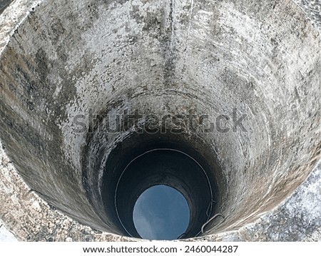 The well in the public bathing area has clear and clean water  Royalty-Free Stock Photo #2460044287