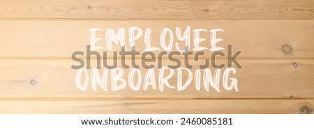 Employee onboarding symbol. Concept words Employee onboarding on beautiful wooden wall. Beautiful wooden wall background. Business employee onboarding concept. Copy space.