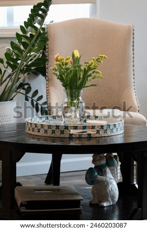 A bouquet of spring flowers on a coffee table.