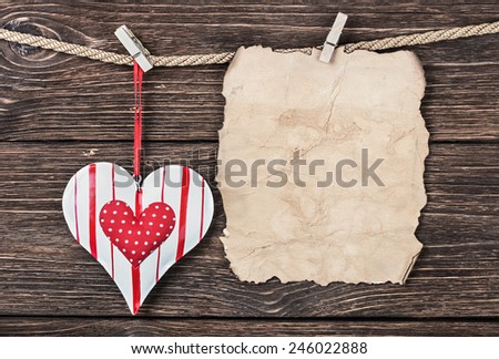 Old paper with heart and place for congratulations Valentine or Mother's Day 