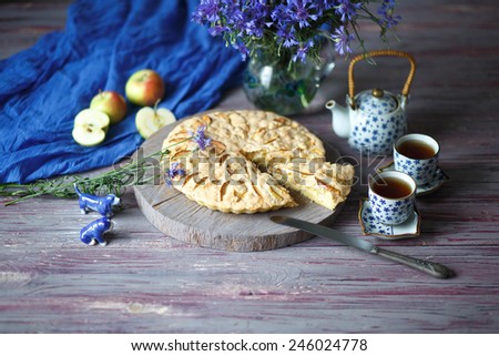 Unusual still life with cornflowers and Apple pie. Royalty-Free Stock Photo #246024778