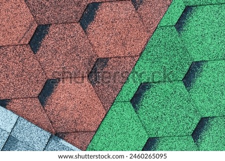 It's close up view of the mosaic colorful tile. It is photo of green, blue and a brown roof tiles. It is view of multicolored texture of tiles.