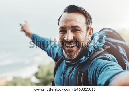 Selfie, hiking and man with nature, travel and excited with happiness, adventure or environment. Portrait, person or hiker with profile picture, health or vacation with journey, getaway trip or smile