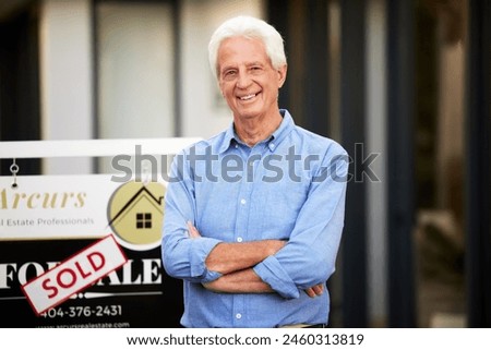 Senior man, portrait and house sold with arms crossed for new home, real estate and relocation. Male person, happy or confident moving to property for retirement, pension and residential investment Royalty-Free Stock Photo #2460313819