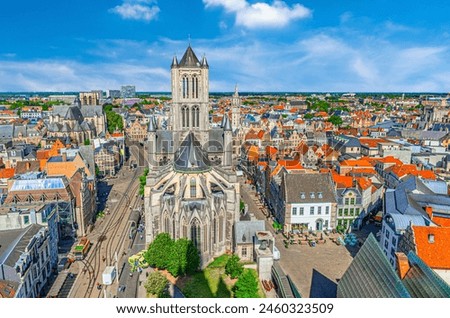 Ghent cityscape, aerial panoramic view of Ghent city centre with Church Sint-Niklaaskerk and old colorful buildings, skyline horizon with blue sky white clouds, panorama of Gent old town, Belgium