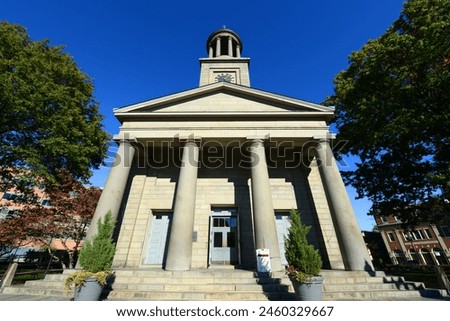 United First Parish Church was built in 1828 in downtown Quincy, Massachusetts MA, USA. Presidents John Adams and John Quincy Adams are buried in the family crypt beneath the church.  Royalty-Free Stock Photo #2460329667