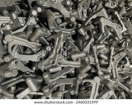 lot of iron die cast parts placed on mass, automotive parts mass production, mass production of iron casting parts, cast iron parts batch mass production Royalty-Free Stock Photo #2460331599