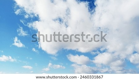 The sun shining through the puffy clouds. 3d ceiling decoration image. Sky bottom up view. Beautiful sunny sky. Stretch ceiling sky model. Royalty-Free Stock Photo #2460331867
