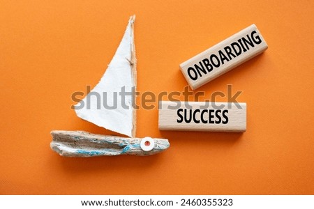 Onboarding Success symbol. Concept word Onboarding Success on wooden blocks. Beautiful orange background with boat. Business and Onboarding Success concept. Copy space