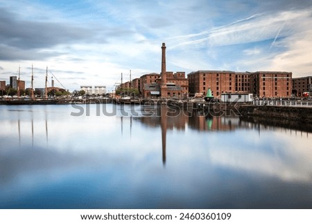 The Pump House pub and Albert Dock buildings reflected in a still Canning Dock, Liverpool, Merseyside, England, United Kingdom, Europe Royalty-Free Stock Photo #2460360109