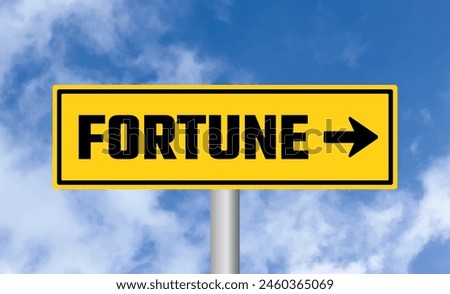 Fortune road sign on blue sky background