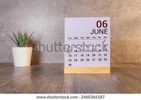 June 09th. Day 9 of month. Calendar cube on modern pink background, concept of bussines and an importent event.