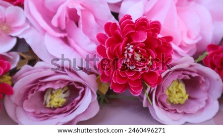 Close-up of the artificial pink flowers. Flower decoration. Flower background. selective focus