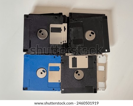 Floppy disks from the 90s. The early days of recording technology. Stack of retro colorful floppy disks. The old forgotten technologies. 