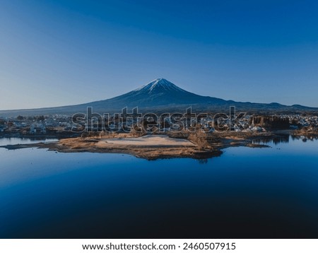Mt. Fuji on a clear day_Snow-capped_Over Lake Kawaguchi_Drone aerial photography