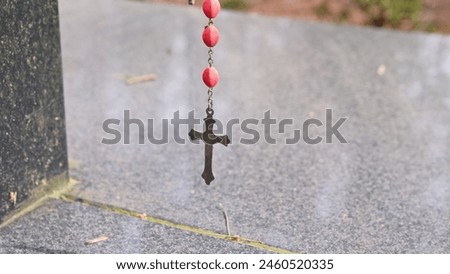 Prayer Rosary Made of Wood Pea Hanged by Pilgrim at Christian Worship Place as Votive Offering Royalty-Free Stock Photo #2460520335