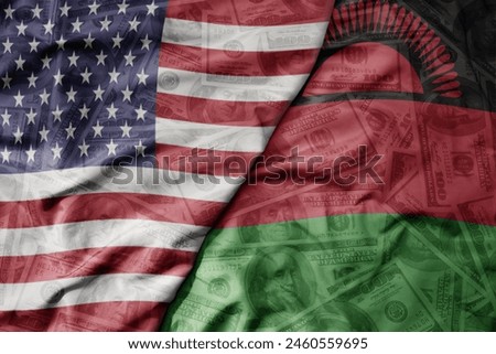 big waving colorful flag of united states of america and national flag of malawi on the dollar money background. finance concept . macro