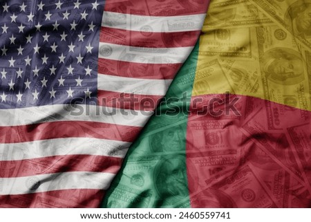 big waving colorful flag of united states of america and national flag of benin on the dollar money background. finance concept . macro