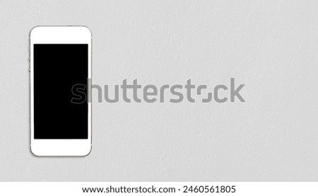 Top view smartphone mock up template with black screen on cement table with copyspace.