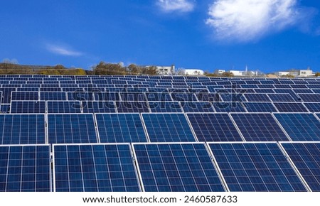 A solar panel converts sunlight into electricity using photovoltaic cells, providing clean, renewable energy for various applications.