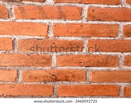 Exposed red brick wall is a popular alternative for building design. It can be used as a wallpaper or background.