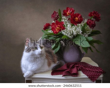 Pretty kitty and beautiful bouquet of flowers