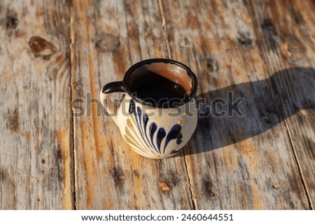 high view of traditional mexican cup made of clay on wooden table Royalty-Free Stock Photo #2460644551