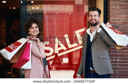 Shopping, sale sign and portrait of couple in city with bags for clothing deal, discount and store promotion. Fashion, boutique mall and man and woman with purchase for bonding, travel and products