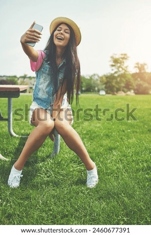 Happy, girl and selfie on bench in park for profile picture on social media or memory of summer vacation in California. Woman, sunshine and holiday with photography or live blog for content creation.